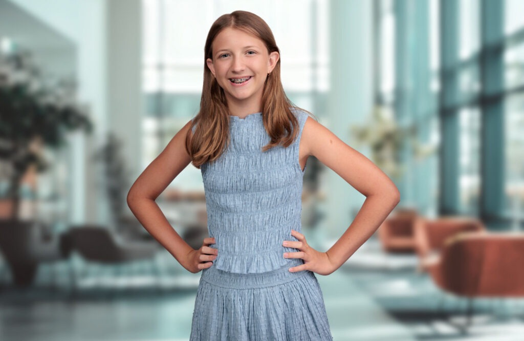 Young patient smiling with braces at Austin Orthodontics